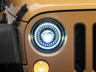 Raxiom 07-18 Jeep Wrangler JK Axial Series 7-In Dragon Eye LED Headlights- Blk Housing (Clear Lens) - J167194 Brand New