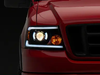 Instant Buy Raxiom 04-08 Ford F-150 Axial Series Projector Headlights w/ SEQL LED Bar- Blk Housing (Clear Lens) - T566364
