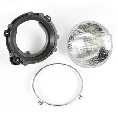 Brand New Omix Headlight Assy With Bulb LH 97-06 Wrangler TJ - 12402.03